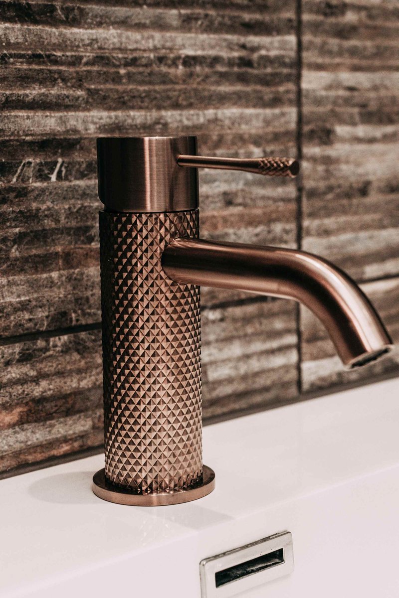 Brushed bronze knurled tap, close-up detail