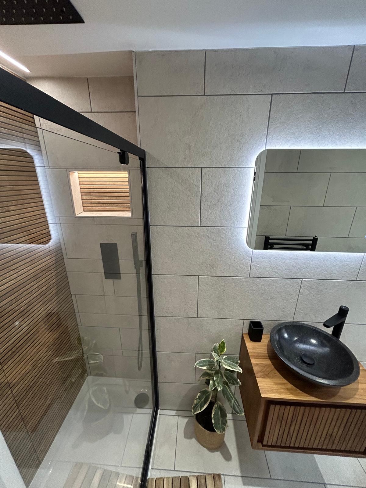 A finished contemporary shower room handed over to the client