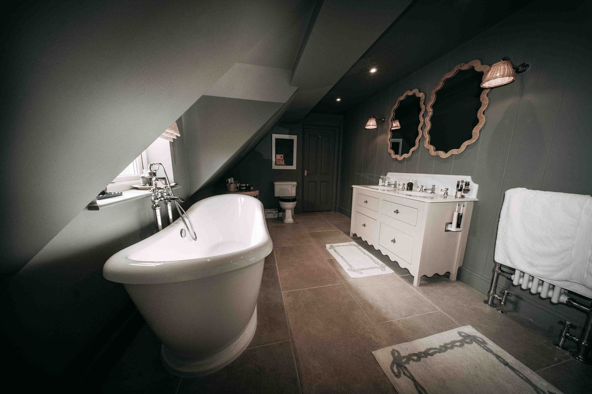 A completed Stonewell bathroom with a freestanding bath in a Cotswolds home
