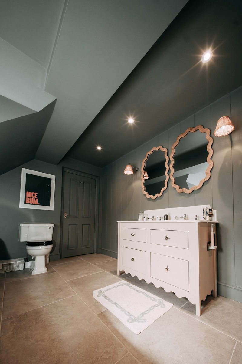 A planned double-vanity scheme with rattan mirrors