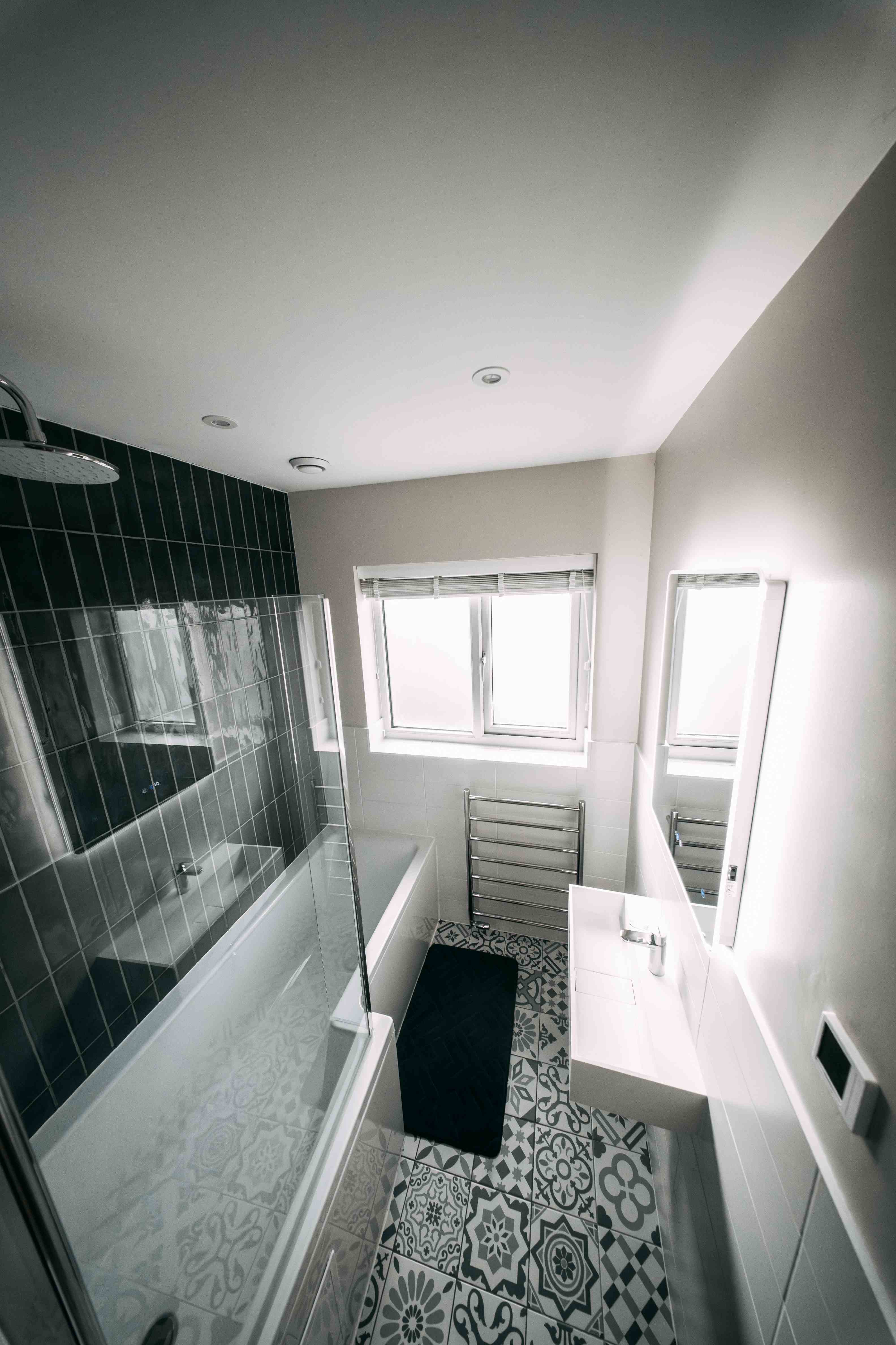 Monochrome bathroom, full length from bath end
