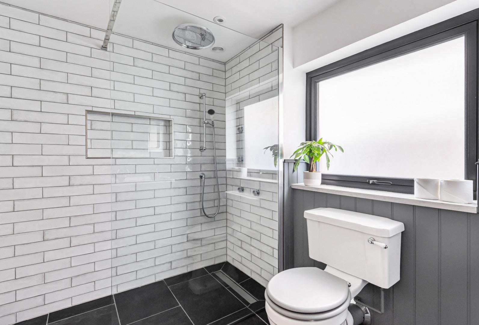 Soft grey bathroom with white metro walk-in shower