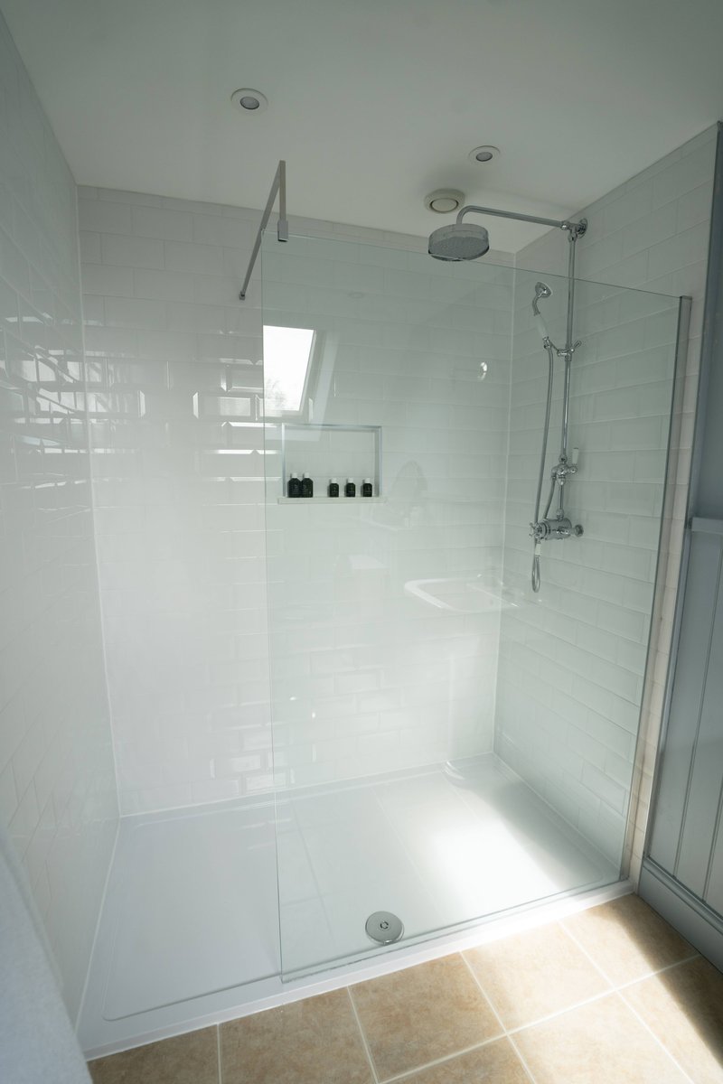 Walk-in shower enclosure, side angle